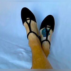 Size 8.5 black T-Strap with 2” Cuban heel.  Excellent condition.  Worn once